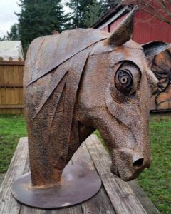 metal sculpture of horse made out of salvaged metal