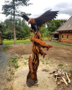 Tree stump art chainsaw carving of eagle by Tomas Vrba